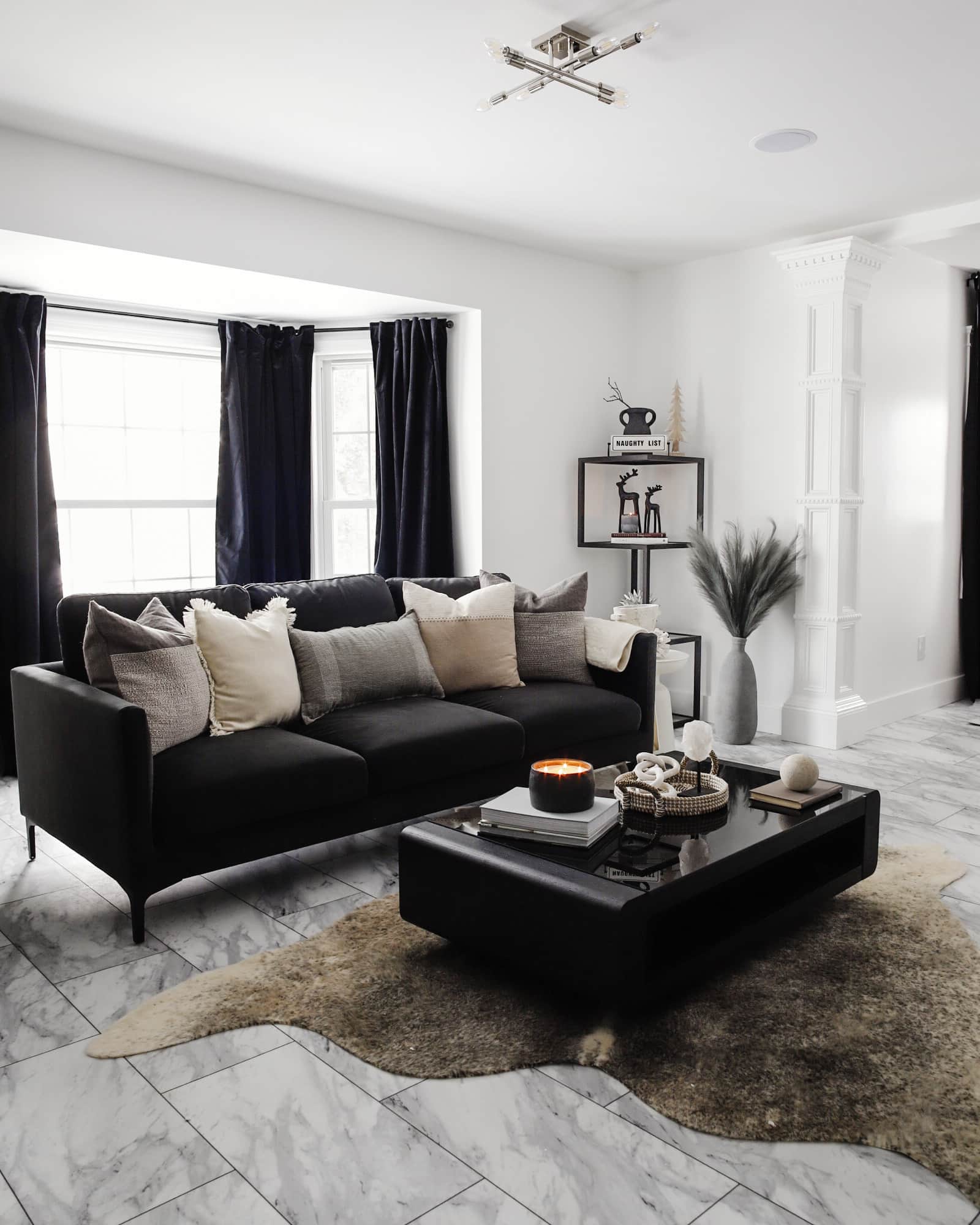 Black sofa 2024 with throw pillows